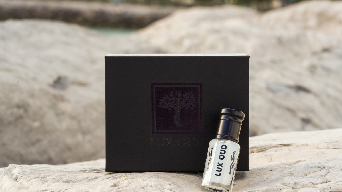 Lux Oud premium fragrance oil packaging on natural stone; illustrative image, see listing for three specific oils included