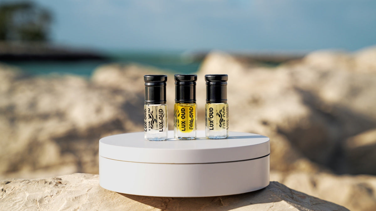 Lifestyle photograph of three Lux Oud fragrance bottles; representative image, see listing for exact fragrances included